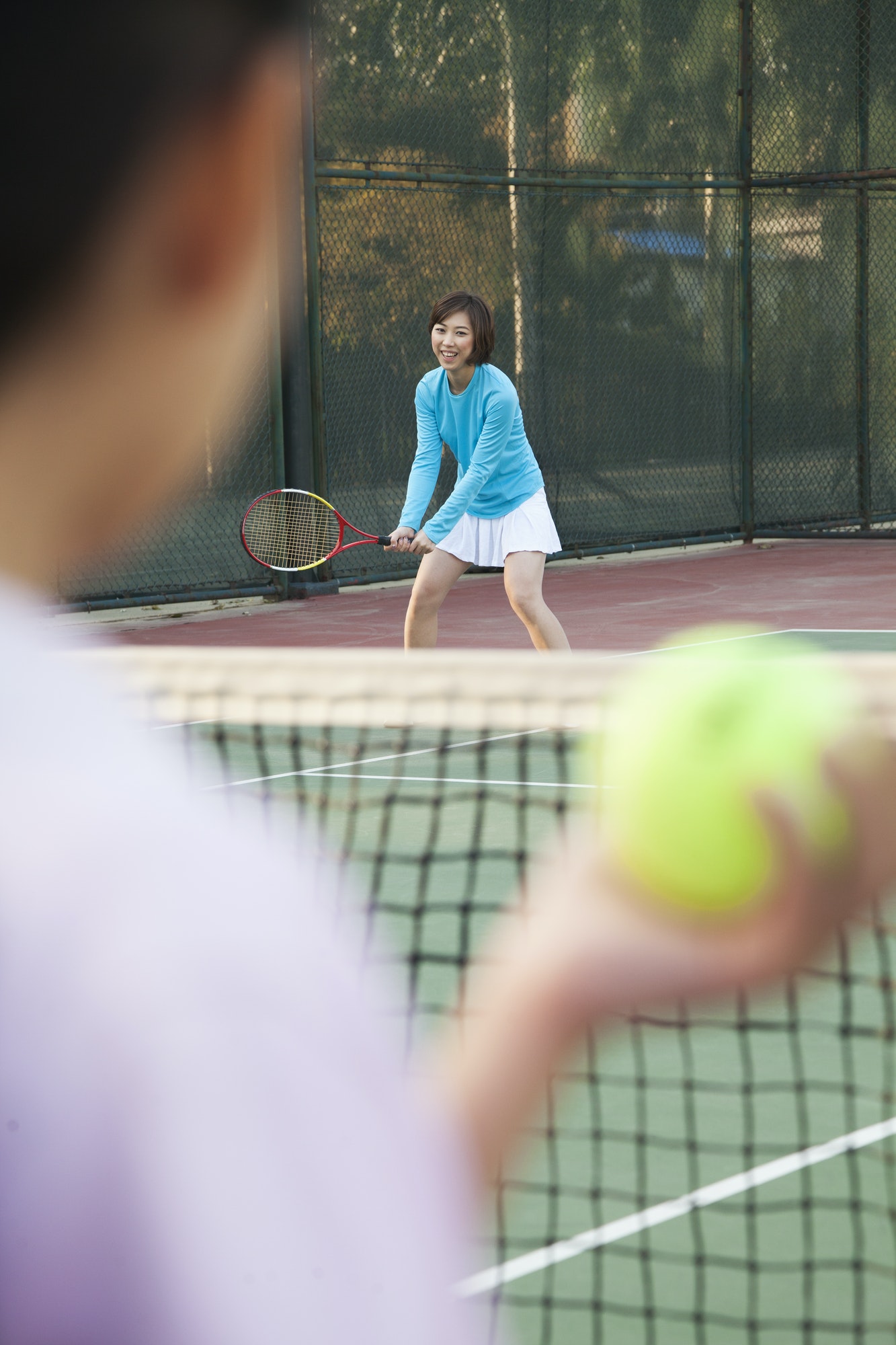 Mother and daughter playing tennis